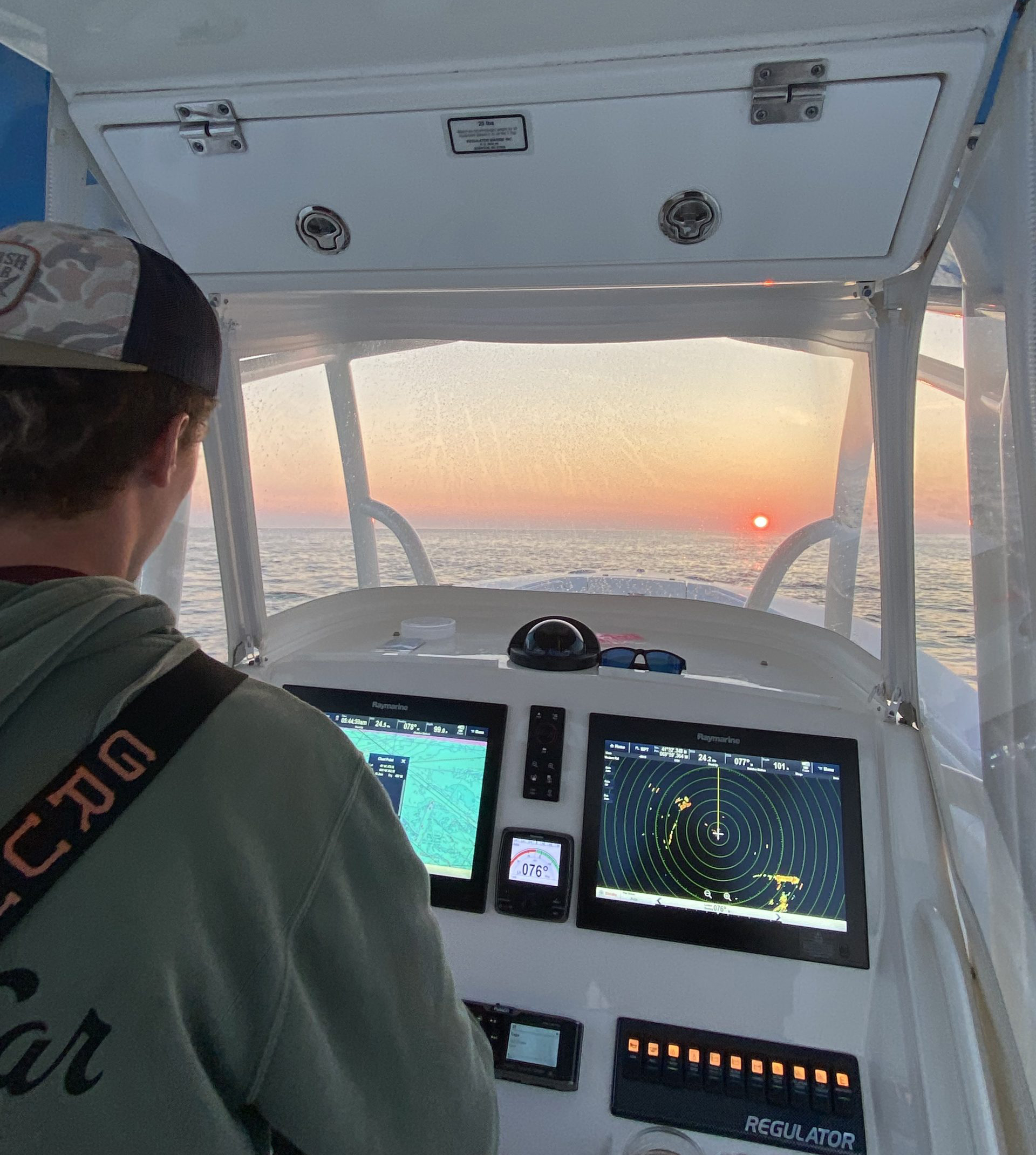 Captain Aidan Kelly steering the boat Captain Aidan Kelly steering the boat