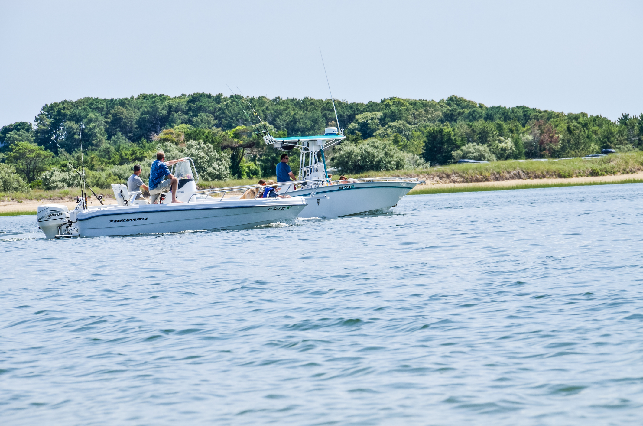 People swimming in motor boat in ocean at Cape Cod